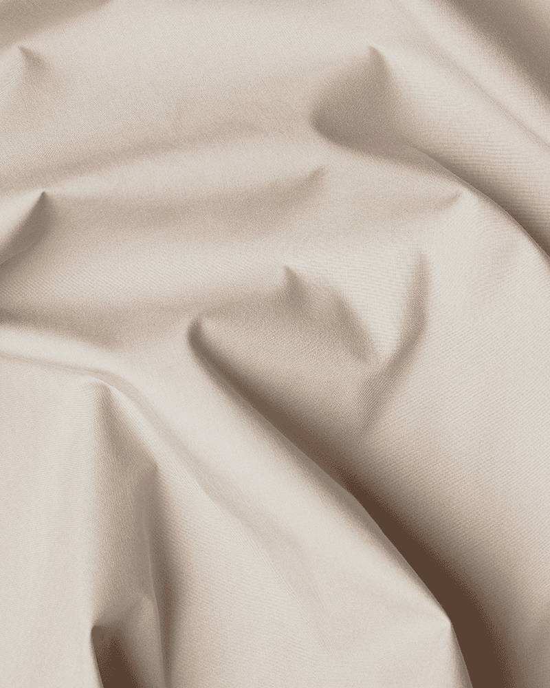 Pormenor do algodão bege certificado OEKO-TEX® utilizado na saia de cama